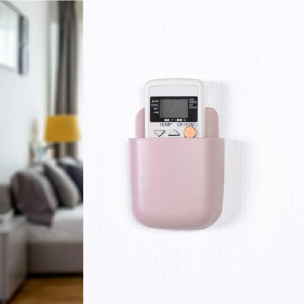 Four white wall mounted phone holders with charging ports displayed against a neutral background. Main image