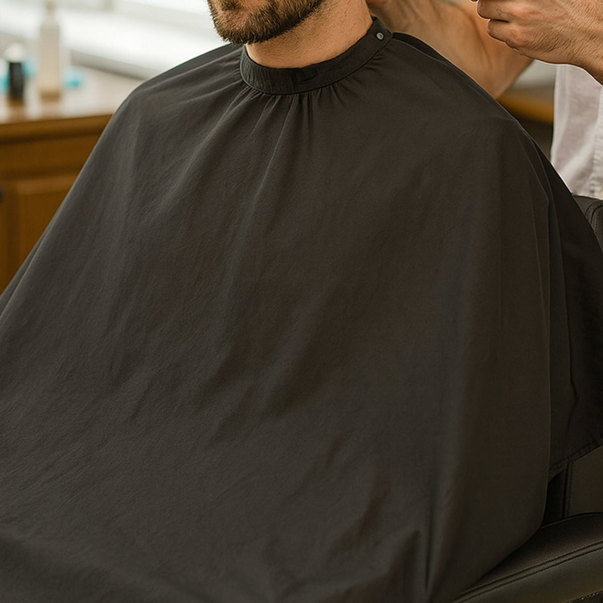 Black Beard Apron Grooming Bib catching hair clippings during a tidy trim. Main image
