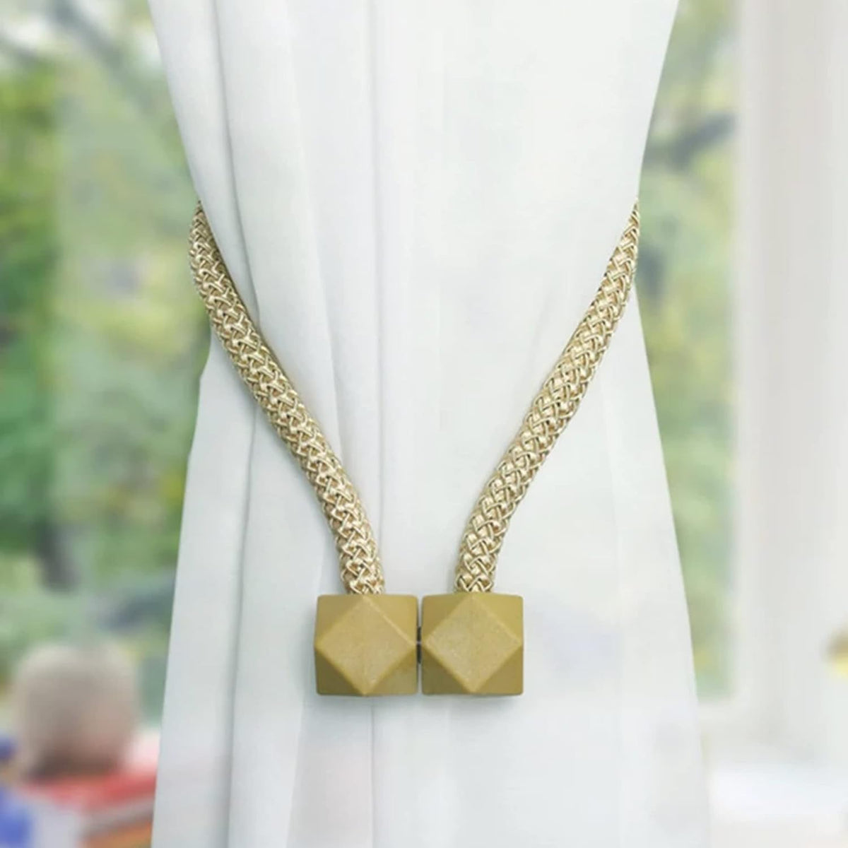 Elegant pearl curtain tiebacks holding back a window curtain, showcasing the non-magnetic design. Main image