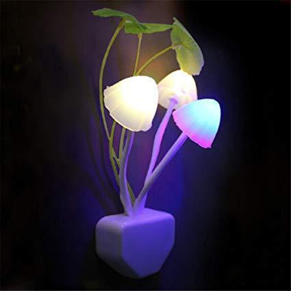 A vibrant LED mushroom night light plugged into a wall socket. Main image