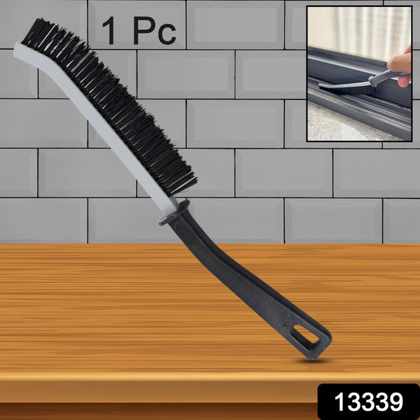 Ergonomic handheld Crevice Cleaning Brush tackling kitchen tile gaps.