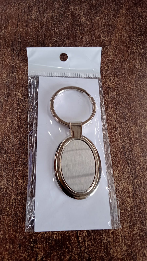 Gift-ready packaged oval metal keychain suitable for corporate gifting