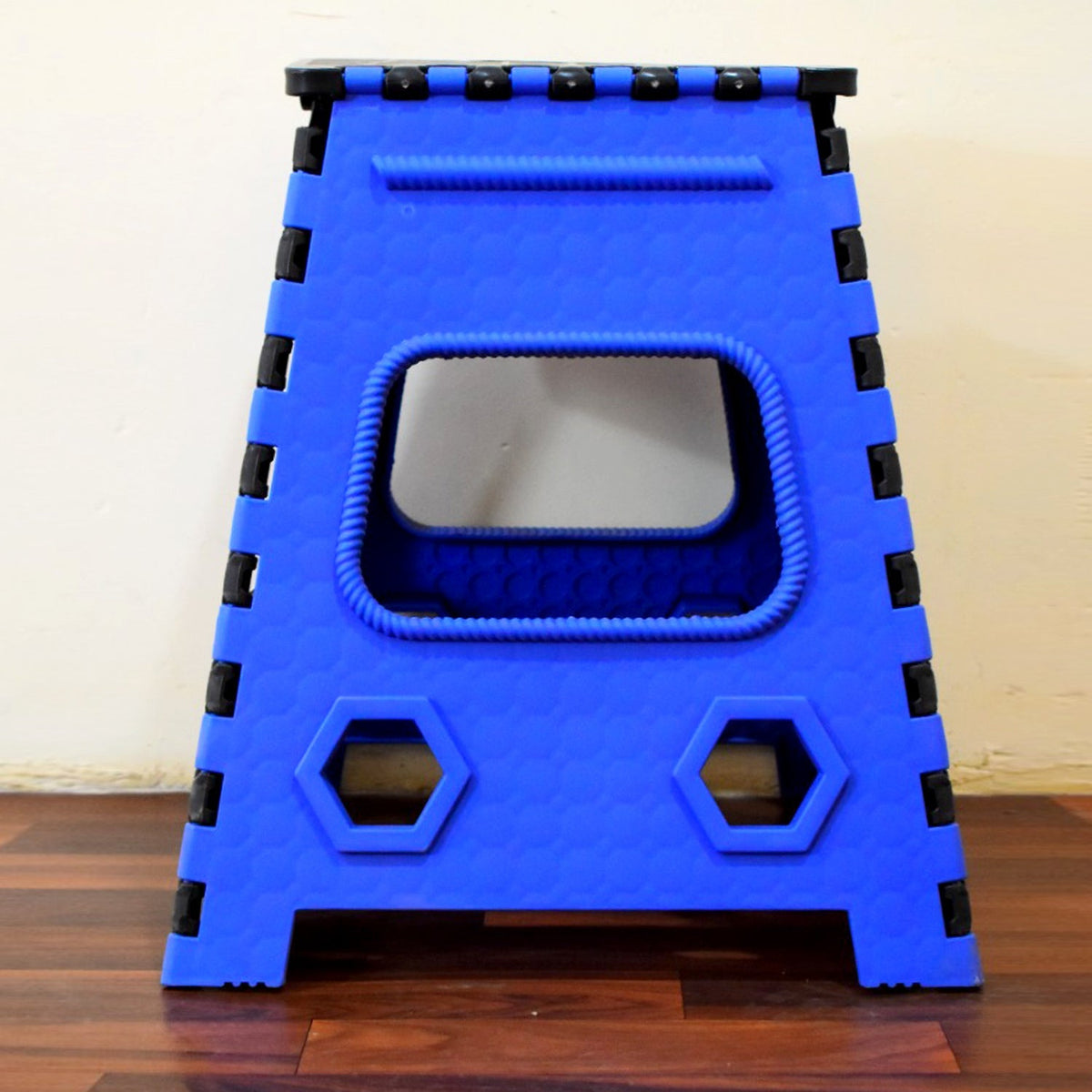 A Tidy Table 18-inch plastic step stool, folded, showing its compact design. Main image