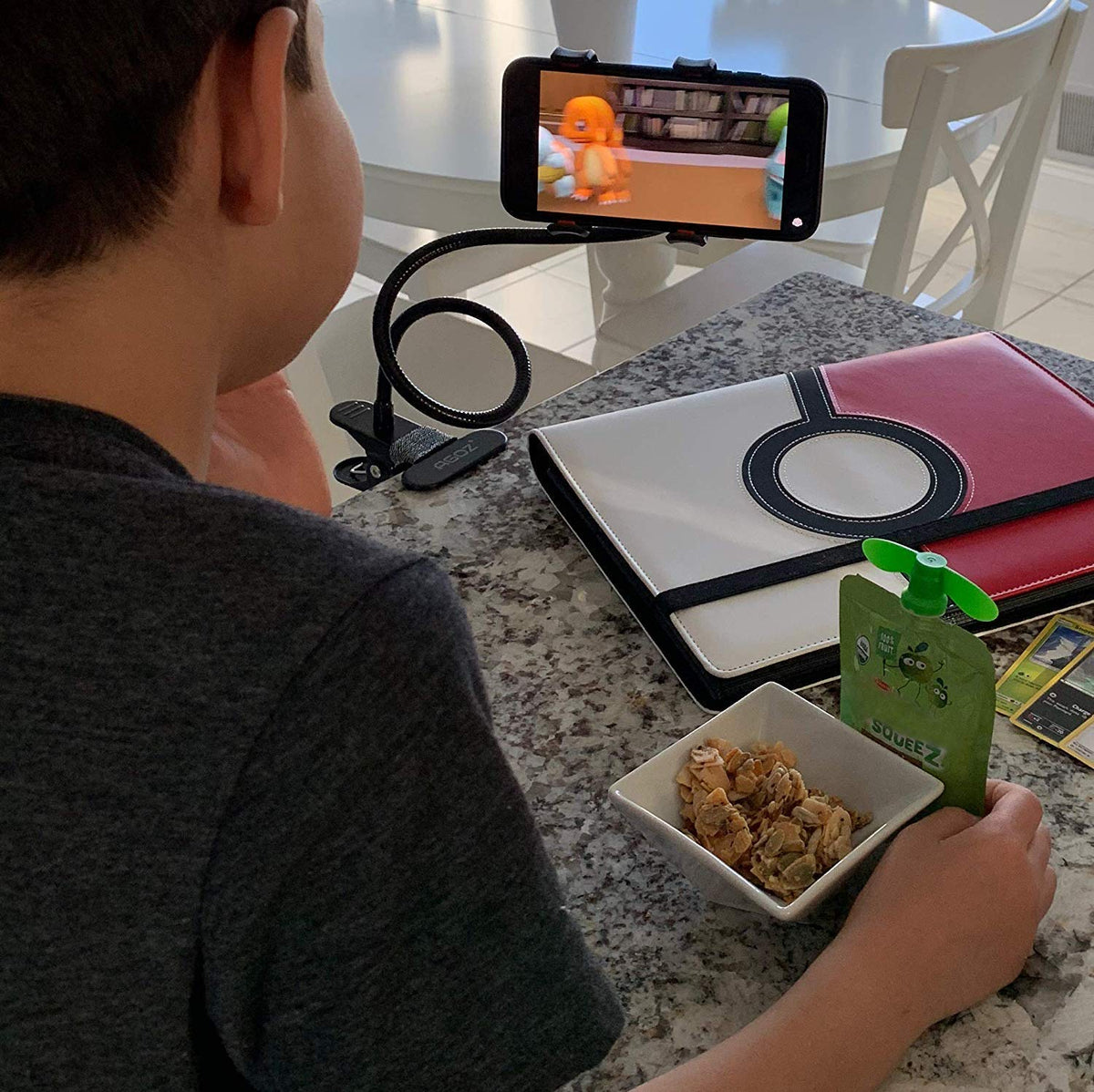 Flexible phone stand with 360-degree rotation for hands-free viewing. Main image