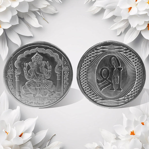 Hand holding the auspicious Decorative Ganesh Coin, ready for pooja or gifting.