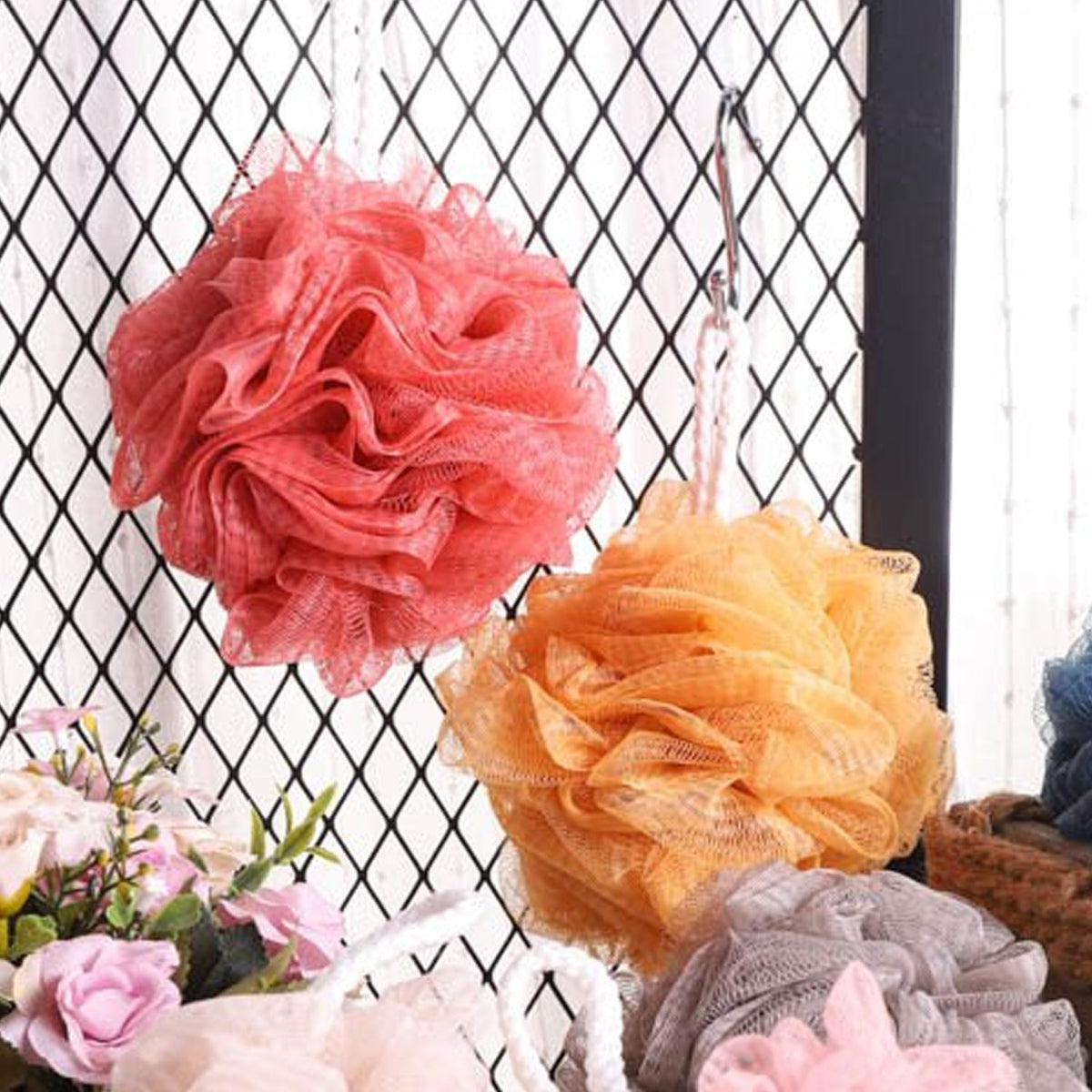 Soft round bath loofah for gentle body scrubbing. Main image