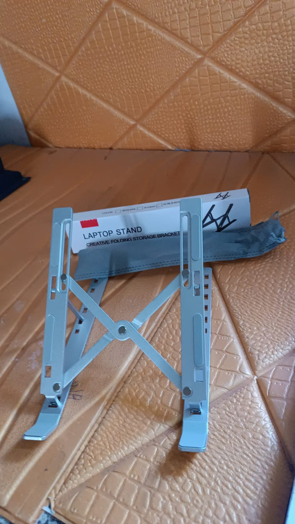 Laptop stand angled to ergonomic height to reduce neck and wrist strain