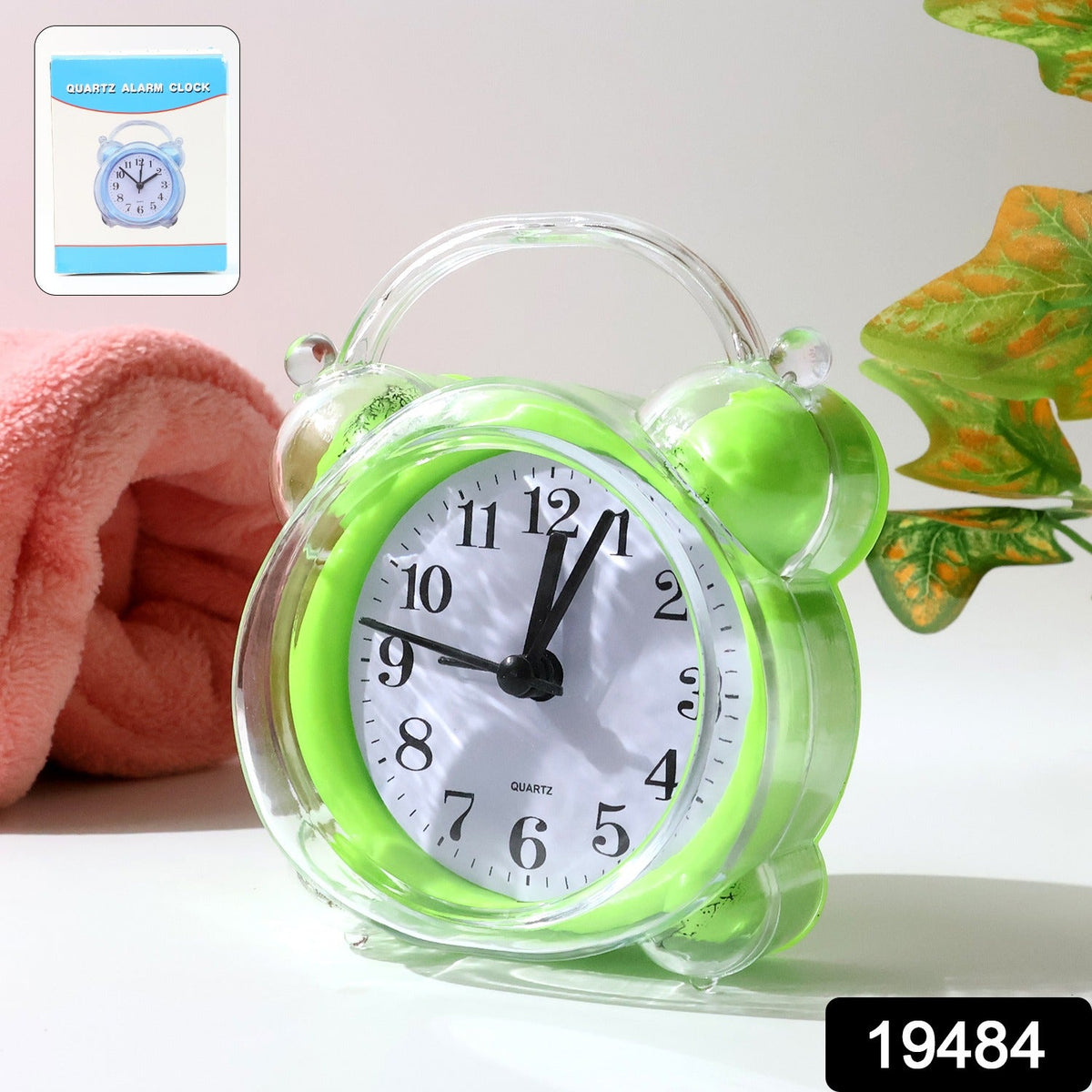 Compact quartz analog alarm clock with green transparent frame on desk Main image