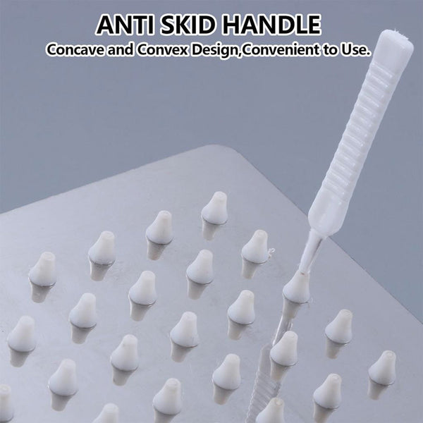 The shower nozzle cleaning brush set ready for use in a bathroom setting.