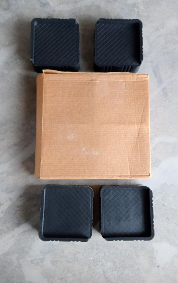 Adjustable base stands providing stable support for a washing machine.