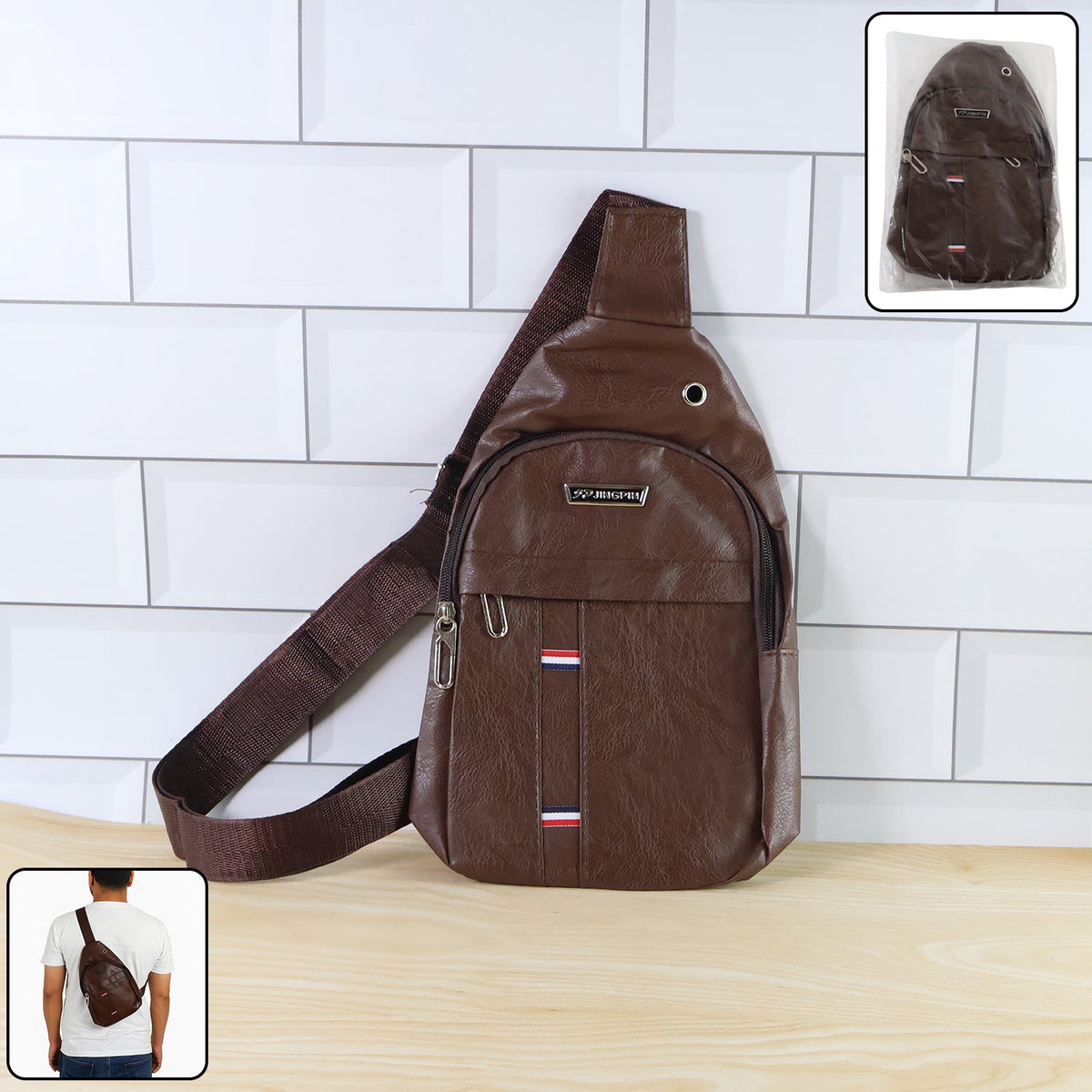 A brown leather crossbody bag with a wide strap, featuring a metal logo and red, white, and blue stripes. Main image