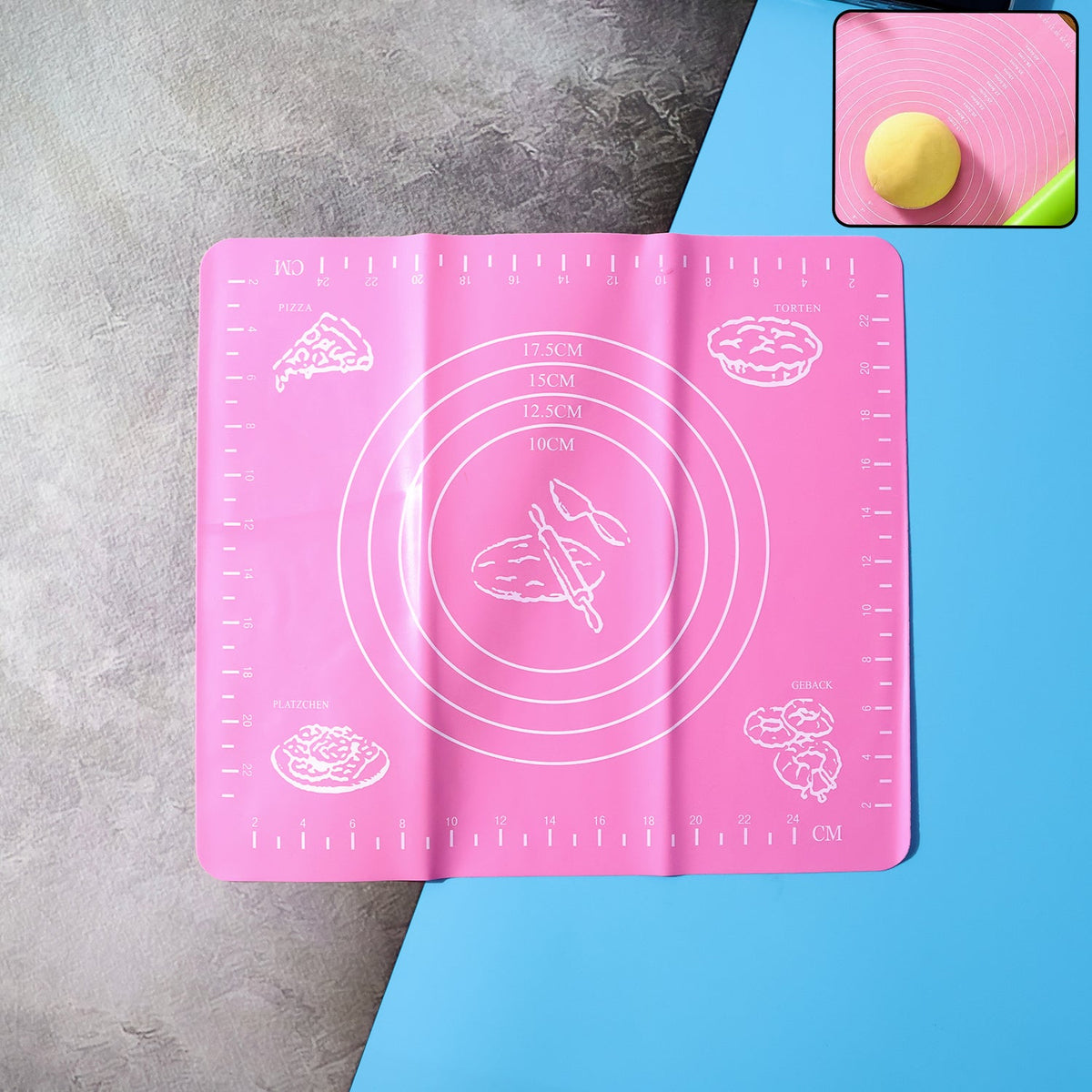 Non-stick silicone baking mat with measurement guides on a counter. Main image