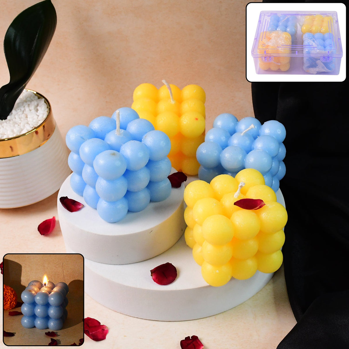 Set of colorful cube candles in blue and yellow with decorative spherical details Main image
