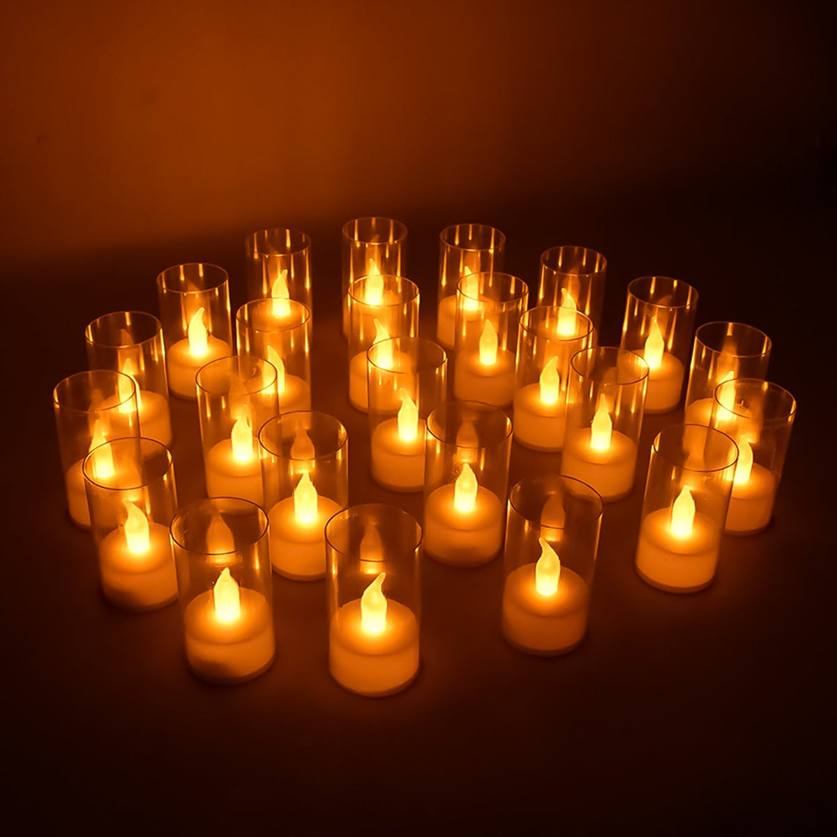 Set of 24 LED flameless candles with transparent covers creating warm glow Main image