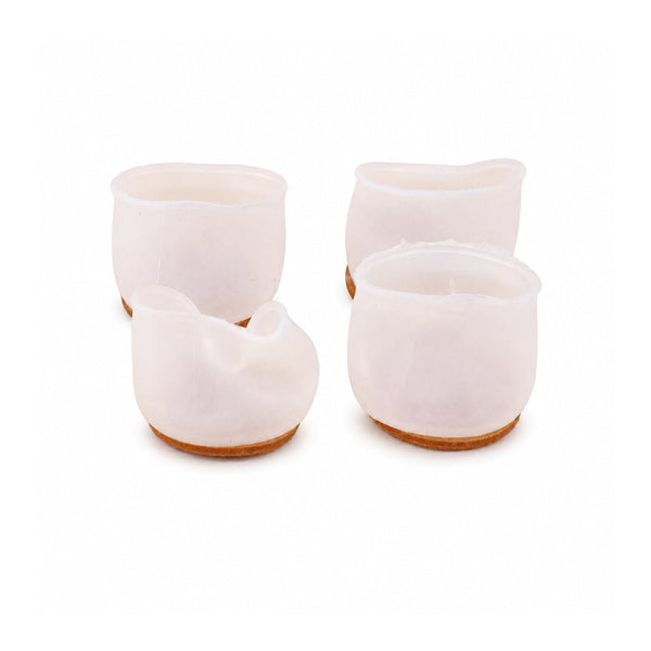 Noise-reducing silicone pads installed on table legs in living room