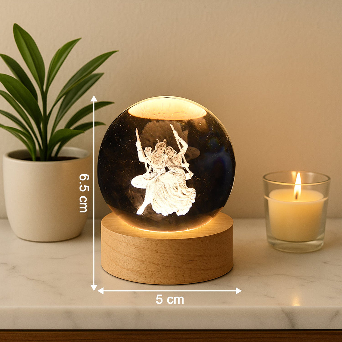 Radha Krishna 3D Crystal Ball Lamp casting a serene light in a darkened room. Main image