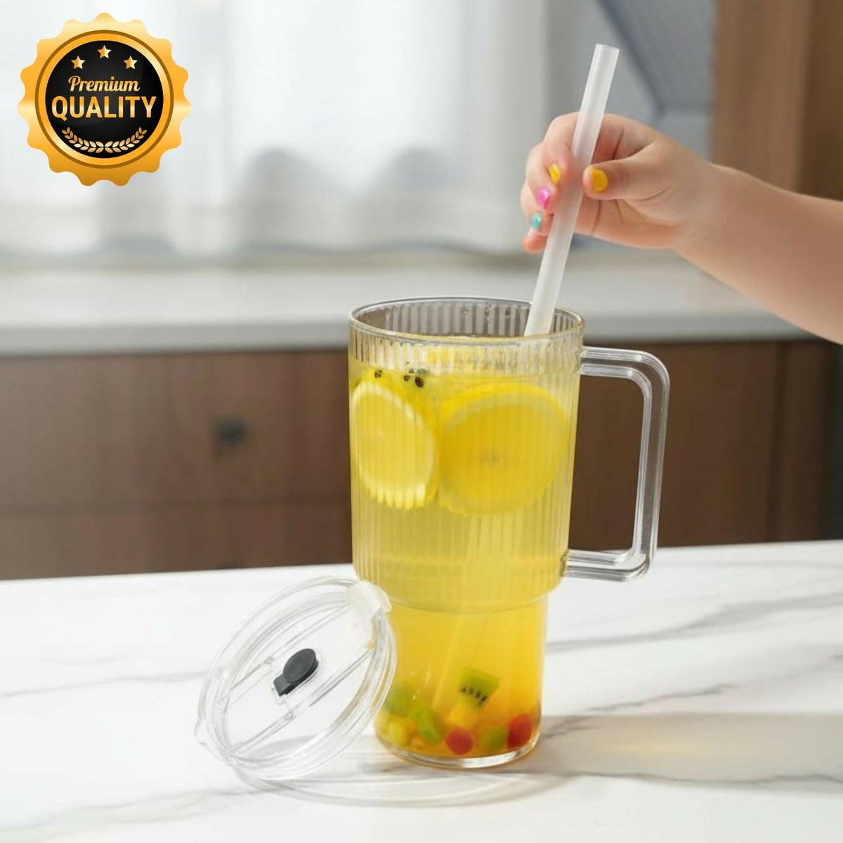 Glass tumbler with handle and reusable straw on white background Main image
