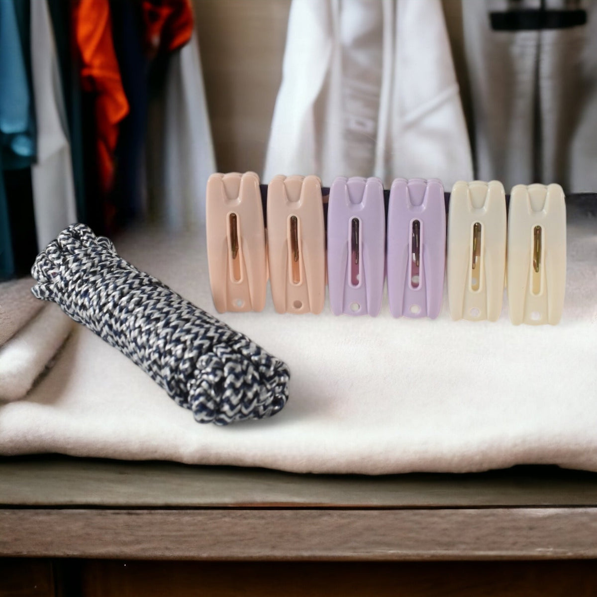 Cloth drying rope with clips hanging clothes securely outdoors Main image