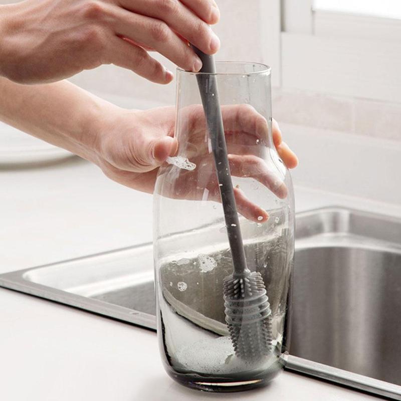 A long-handled bottle cleaning brush with white bristles for deep cleaning. Main image