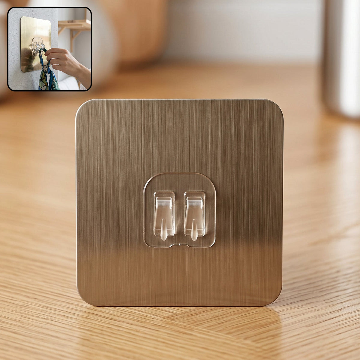 Self-adhesive wall hook with metallic finish and dual prongs for versatile hanging. Main image
