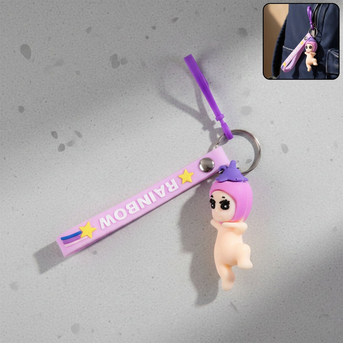 Baby doll silicone keychain with wrist loop strap attached to keys Main image
