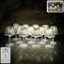 Crystal style LED table lamp with warm yellow glow on a table