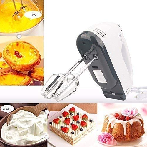 Electric hand mixer with stainless steel beaters on a kitchen counter. Main image