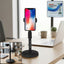Adjustable 360° rotating mobile phone holder with heavy base on desk