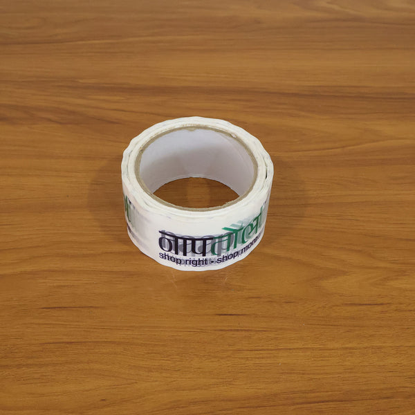 Applying printed packaging tape to seal a package, demonstrating its practicality for courier use.