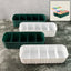 Four 5-compartment drawer organizers neatly stacked, storing socks and underwear.