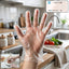 Person wearing large clear disposable plastic gloves for food prep and cleaning