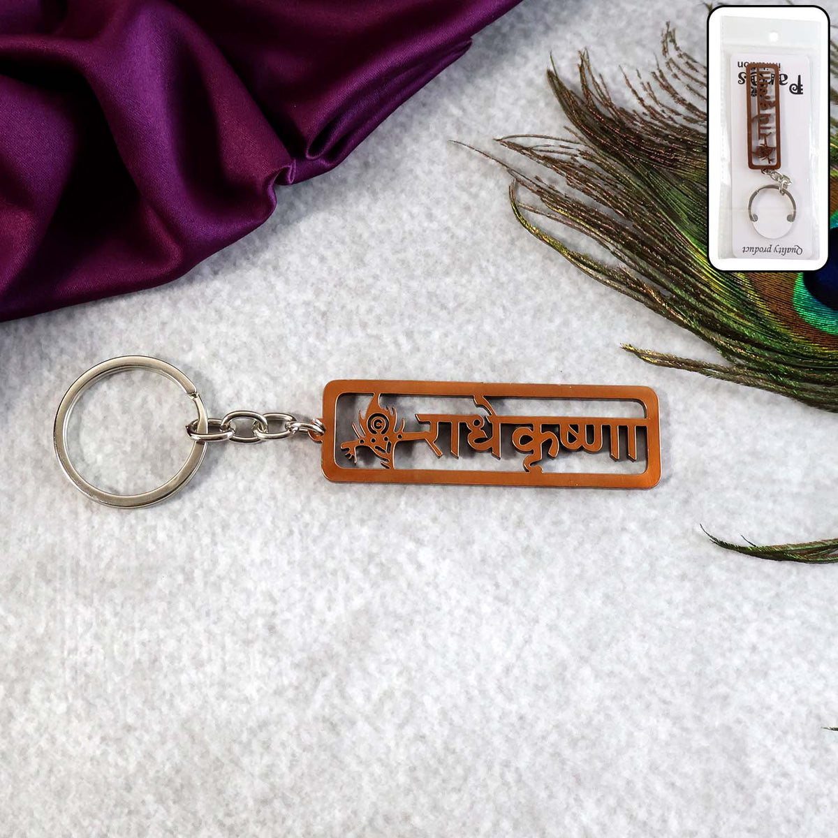 Radha Krishna Metal Keychain with laser-cut Hindi inscription and peacock feather motif Main image