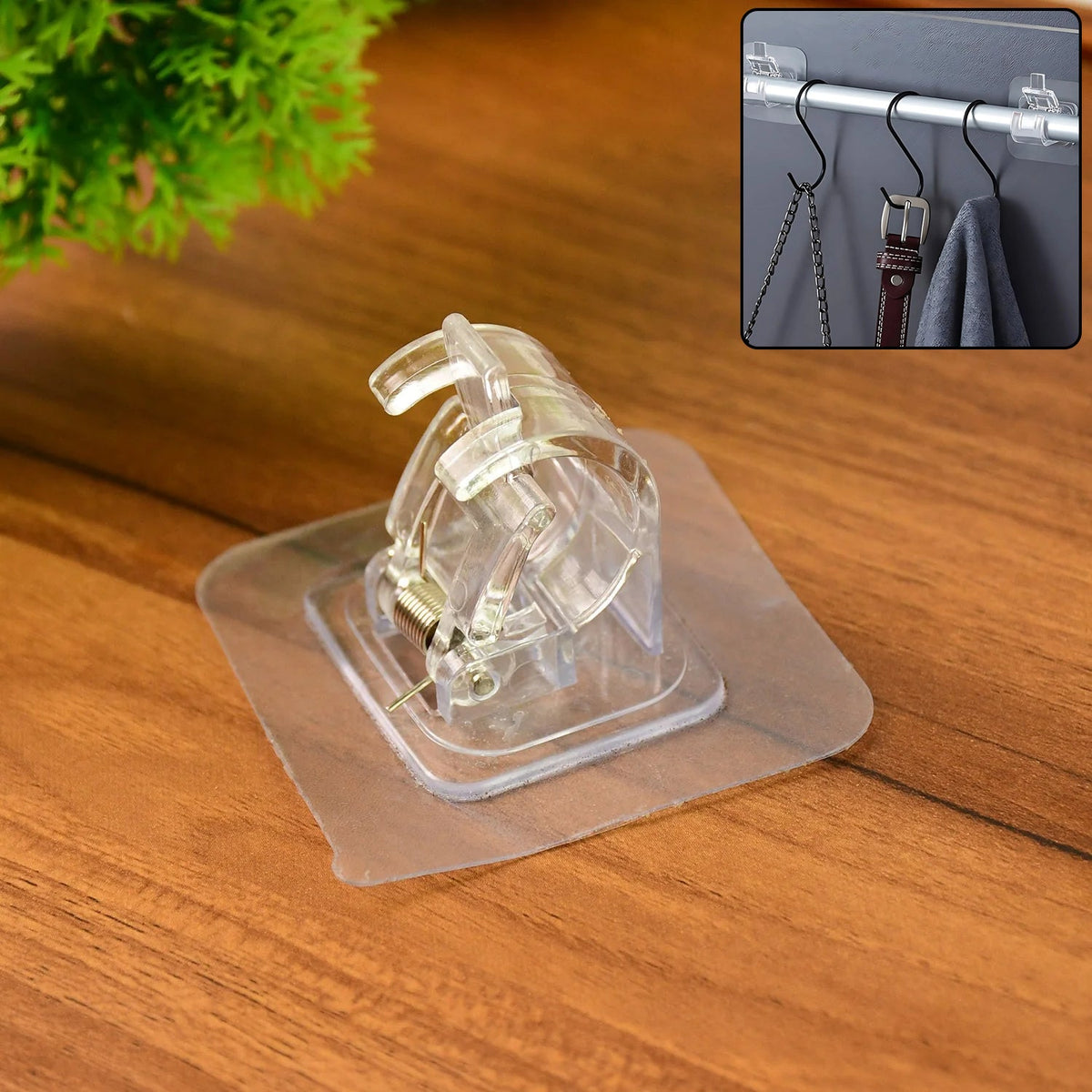 Transparent self-adhesive wall hook mounted on a smooth wall, supporting household items Main image
