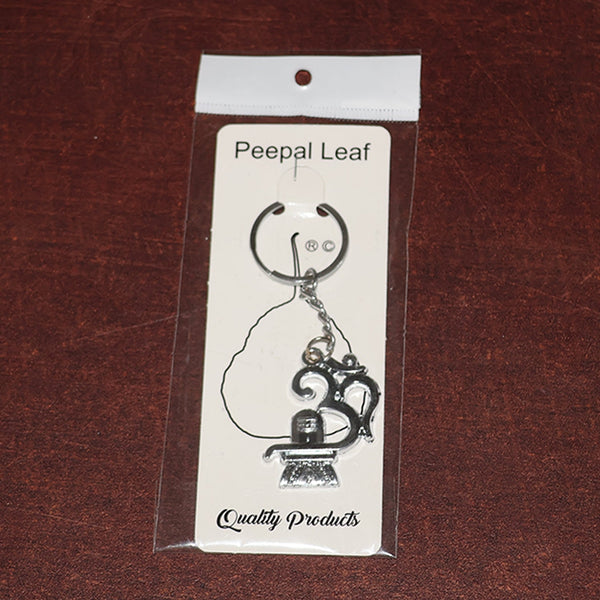 Spiritual metal keychain featuring Om symbol and Shivling icon