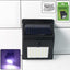 Solar powered LED wall light with motion sensor illuminating garden pathway