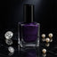 Bottle of Purple Dazzle glitter nail paint with sparkling finish