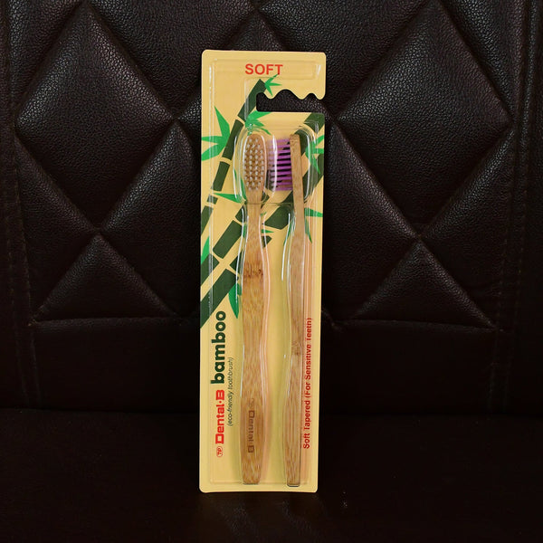 Angled view highlighting bamboo toothbrush with medium bristles