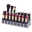 Clear acrylic lipstick holder with 24 sections, showcasing its organized cosmetic storage on a vanity.