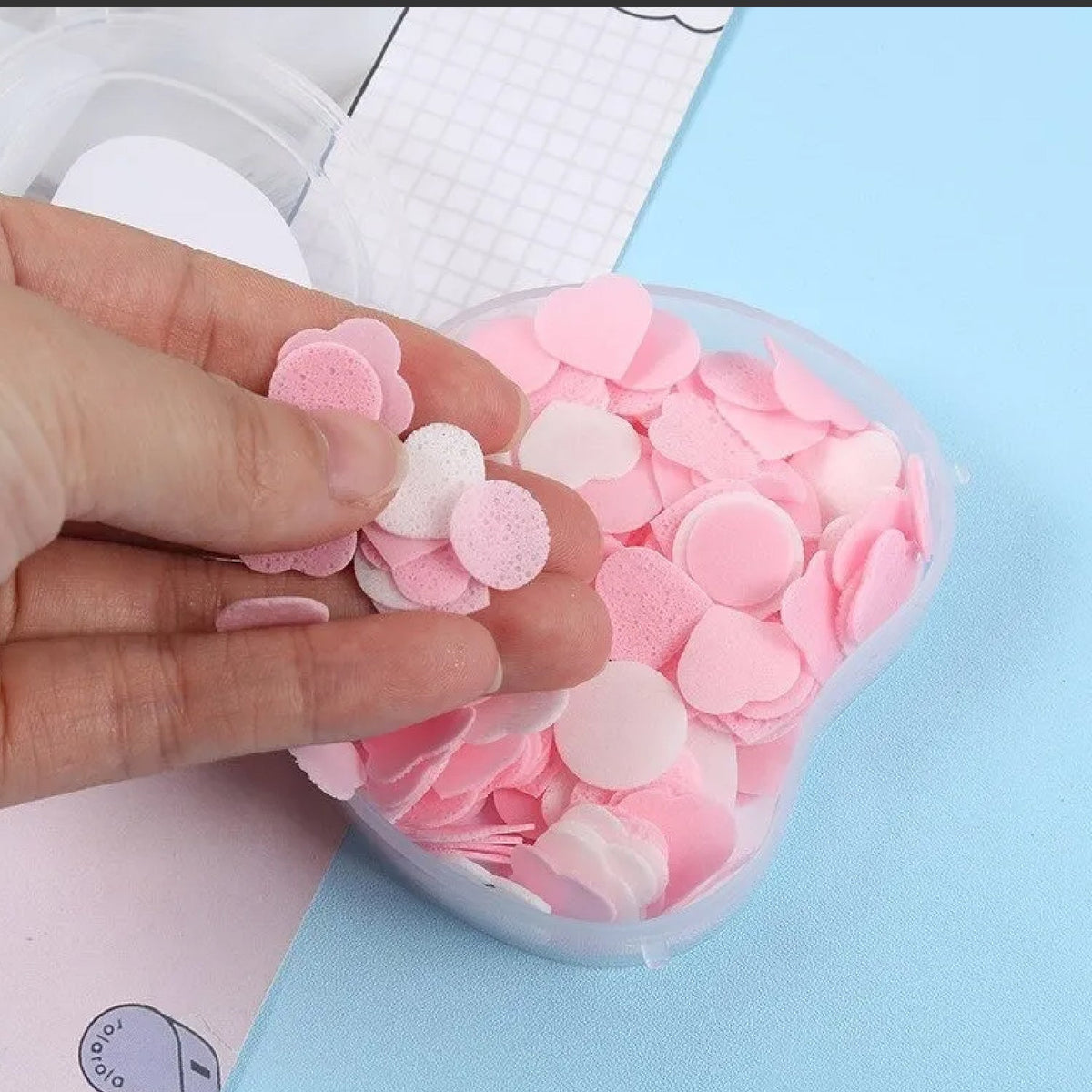 Apple design paper soap dissolving in water, creating a rich lather. Main image