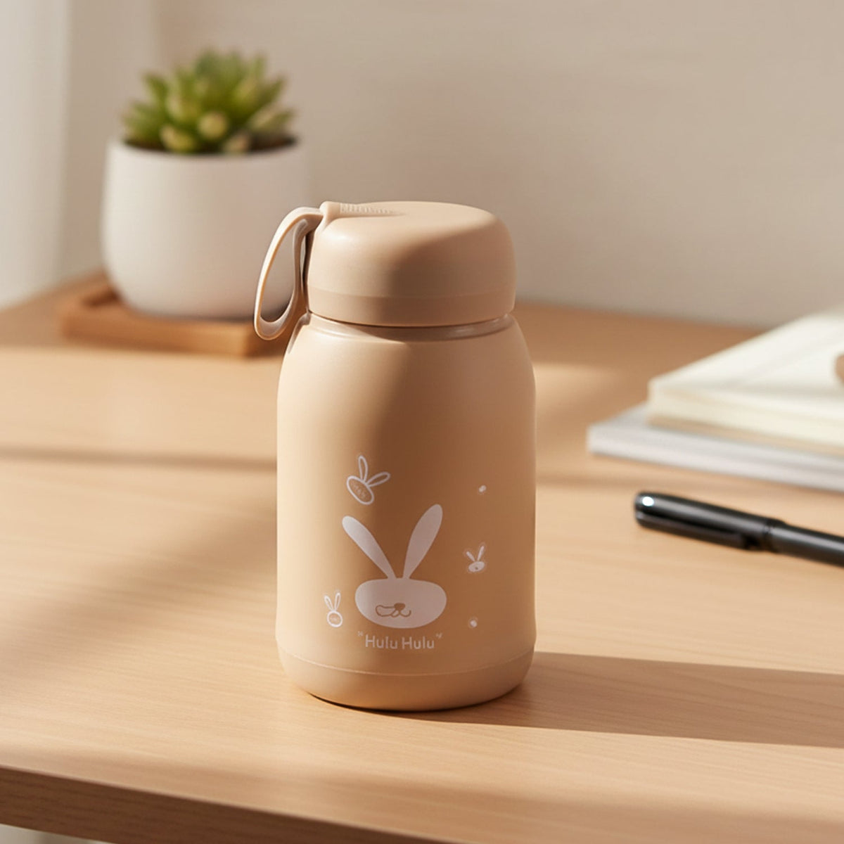 Bunny print glass water bottle with leak-resistant lid and carry loop Main image