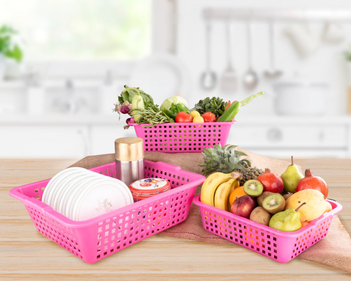 Set of three Plastic Cane Fruit Baskets in large, medium, and small sizes on a kitchen counter. Main image