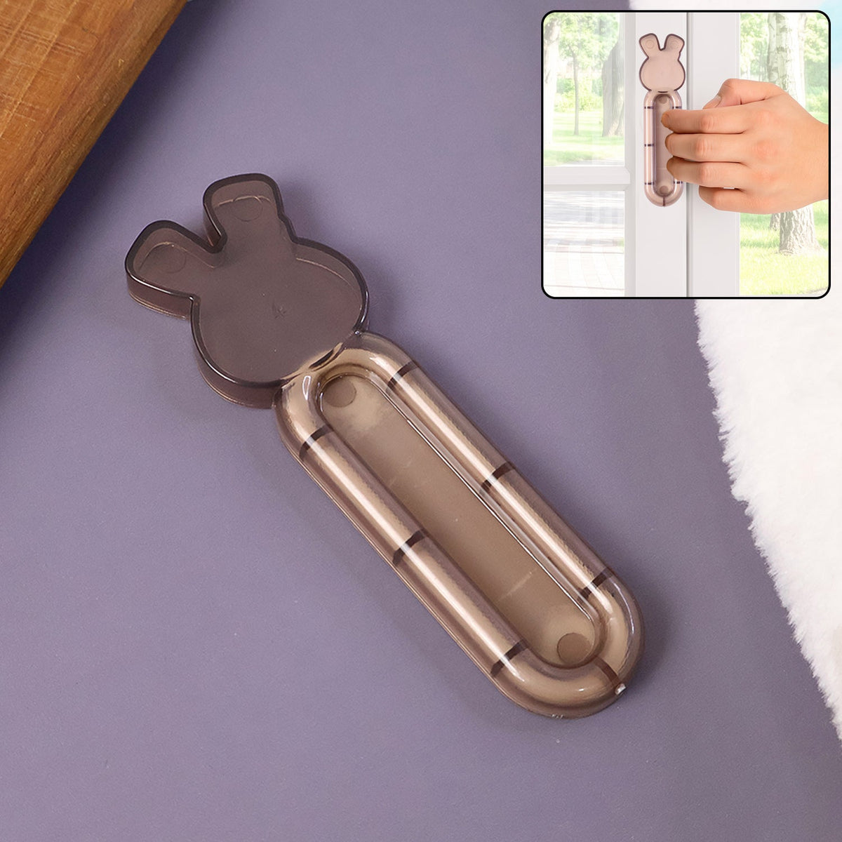 Self stick cabinet handle attached to a smooth cabinet door Main image