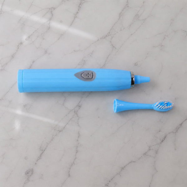 The travel electric toothbrush with its protective cap on, ready for packing and transport.