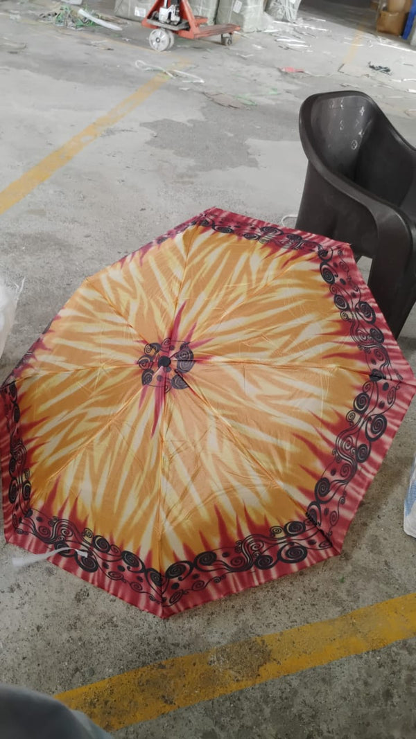 Person outdoors holding 3-Fold foldable umbrella for sun and rain protection