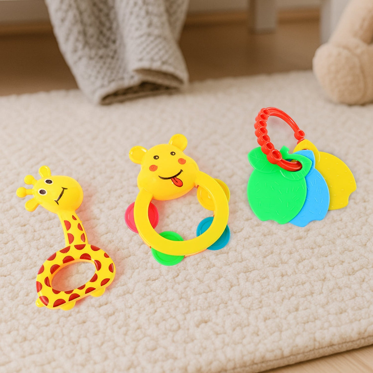 Three-piece baby rattle set featuring colorful animal shapes for sensory play Main image