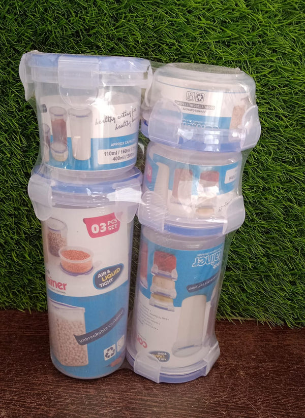 An organised display of multiple round airtight food storage containers on a kitchen shelf.