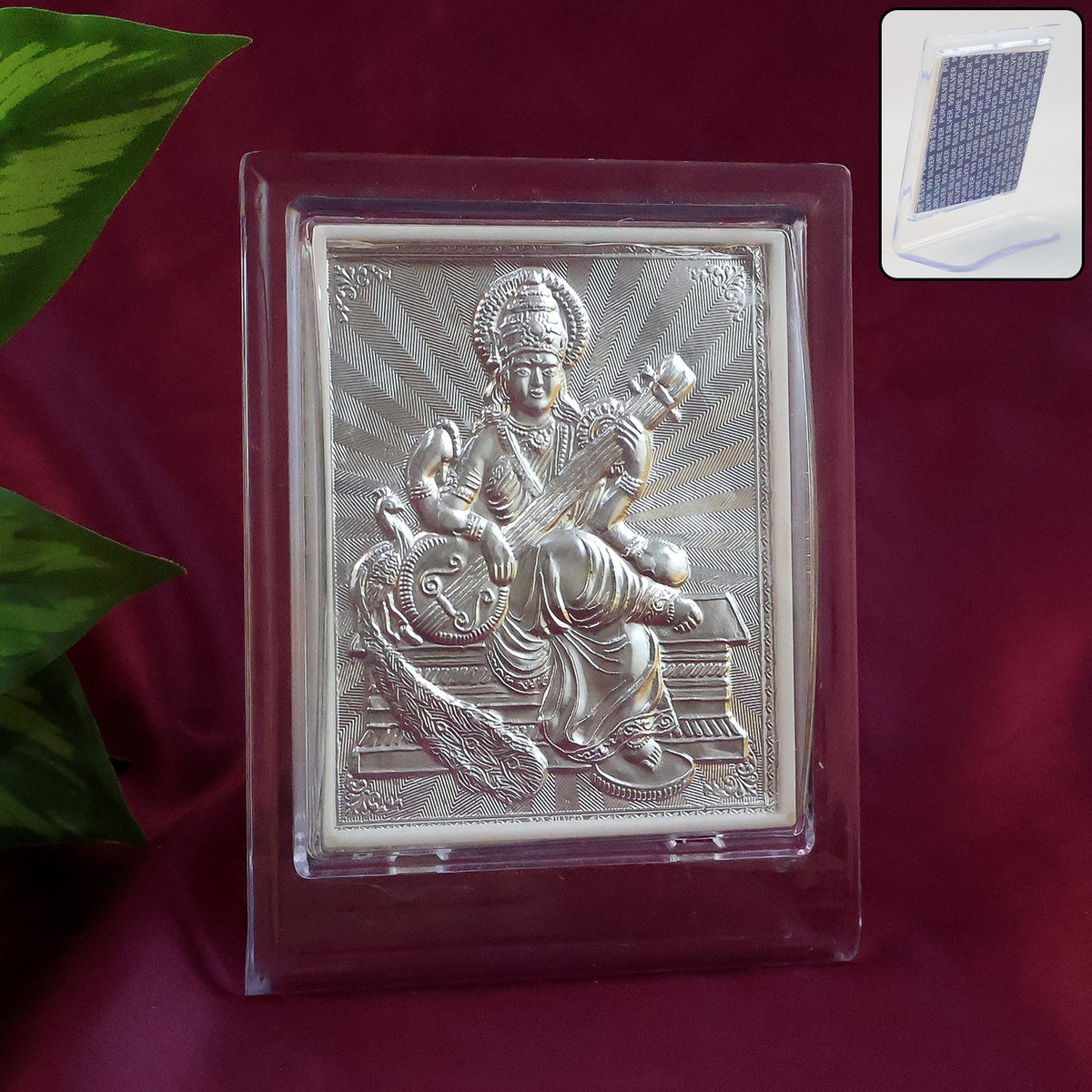 Silver Saraswati Maa photo frame with stand placed on a white surface Main image