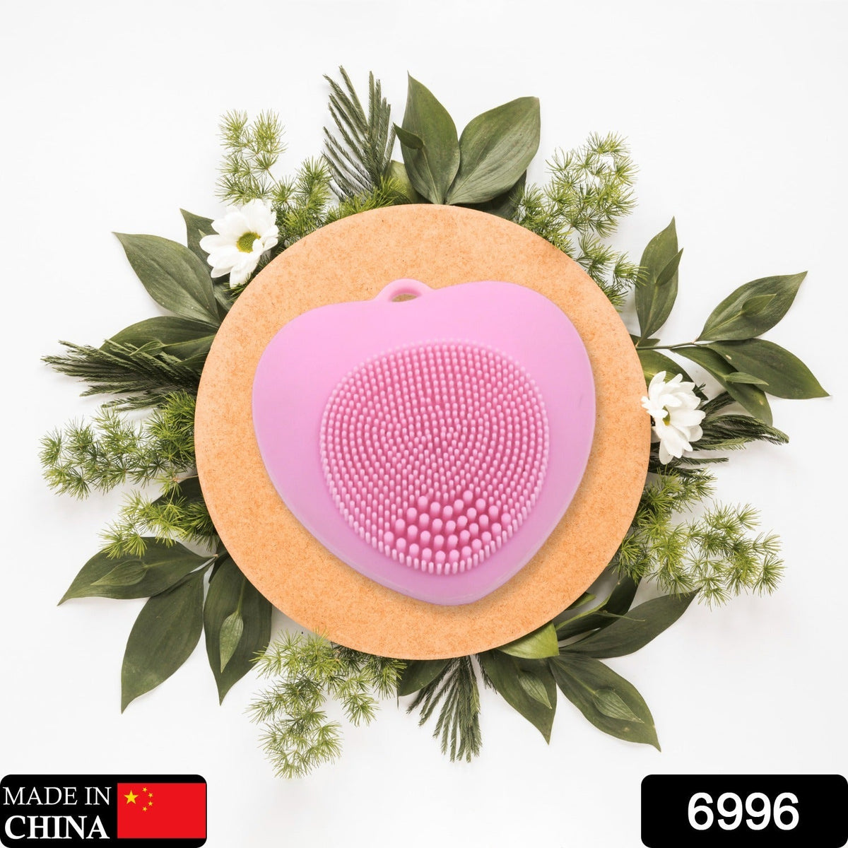 Heart-shaped silicone face wash brush for deep skin cleansing. Main image