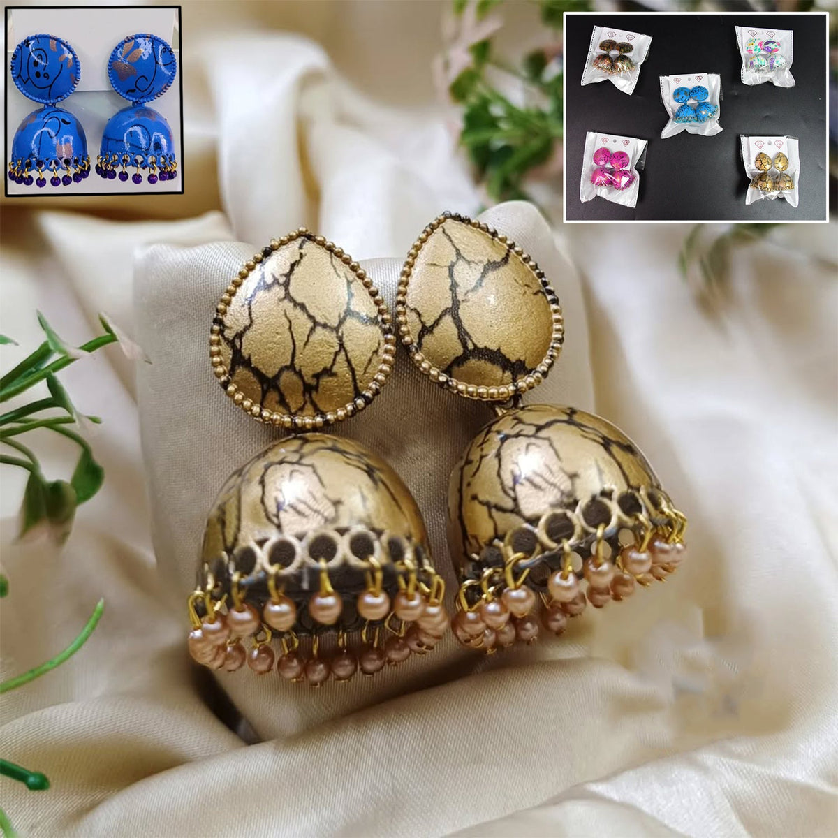 Close-up of a pair of intricate gold-toned Jhumka Earrings with pearl drops, perfect for traditional Indian wear. Main image