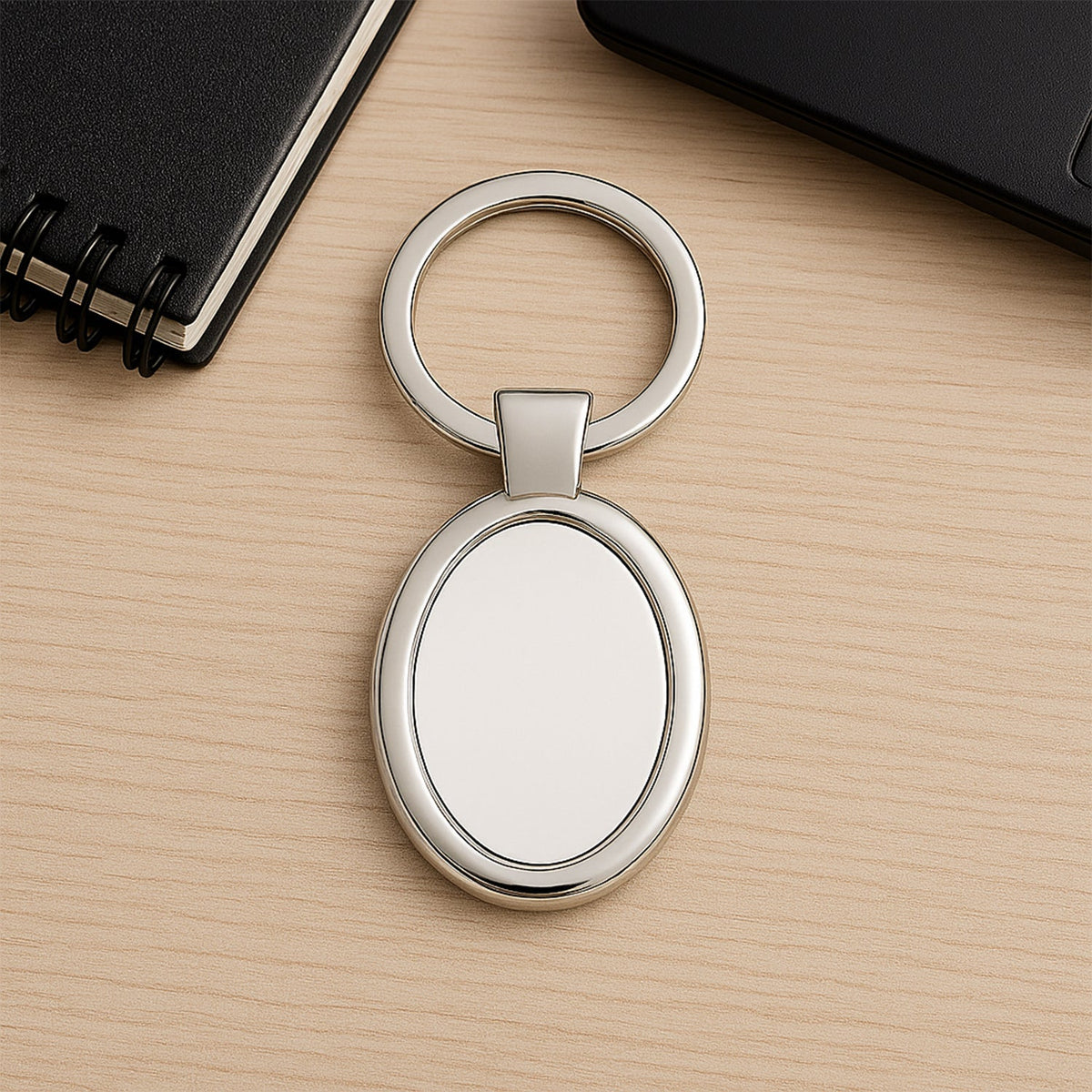 Oval shape metal keychain with premium chrome finish for personal use Main image